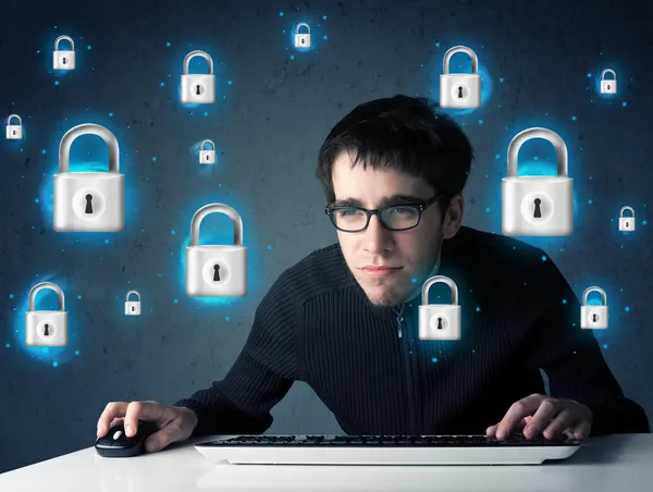 Young hacker with virtual lock symbols and icons — Stock Photo, Image