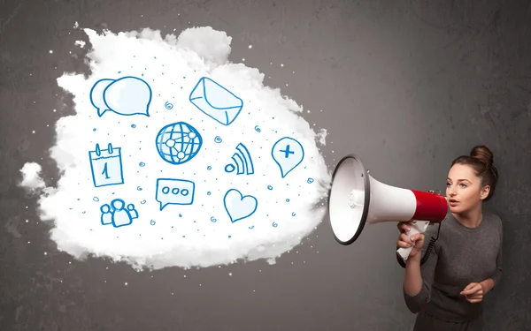 Woman shouting into loudspeaker and modern blue icons and symbol — Stock Photo, Image