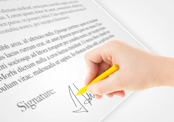 Hand writing personal signature on a paper form — Stock Photo, Image