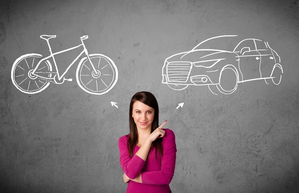 Woman making a choice between bicycle and car — Stock Photo, Image