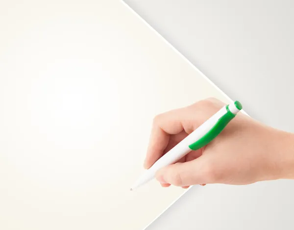 Hand writing on plain empty white paper copy space — Stock Photo, Image