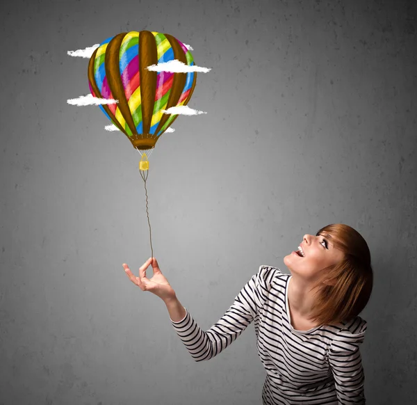 Woman holding a balloon drawing — Stock Photo, Image