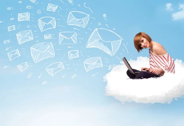 Young woman sitting in cloud with laptop — Stock Photo, Image