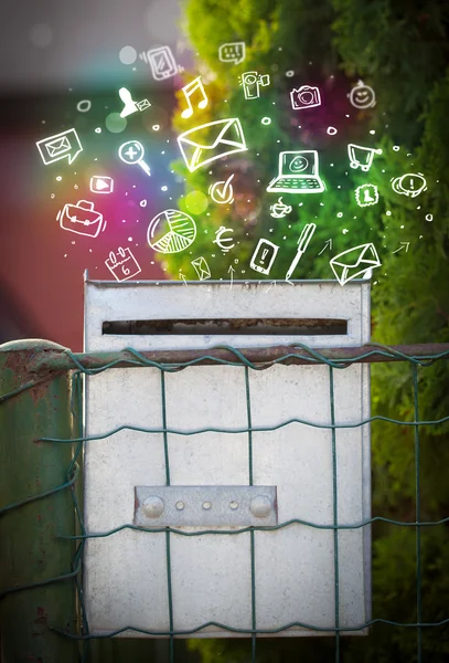 Colorful icons and symbols bursting out of a mailbox — Stock Photo, Image