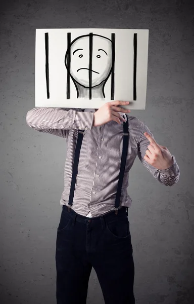 Businessman holding a paper with a prisoner behind the bars on i — Stock Photo, Image