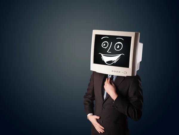 Szczęśliwy biznesmen z głową monitora PC i uśmiechniętą buźką — Zdjęcie stockowe