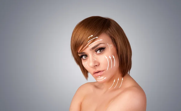 Beautiful girl with facial arrows on her skin — Stock Photo, Image