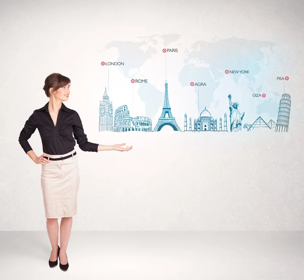 Business woman presenting map with famous cities and landmarks — Stock Photo, Image