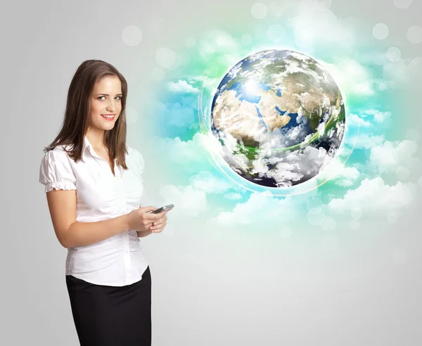 Young woman with earth and cloud concept — Stock Photo, Image