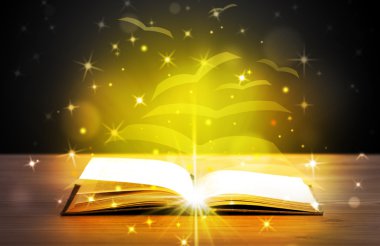 Altından parlak uçan kağıt sayfaları olan açık bir kitap