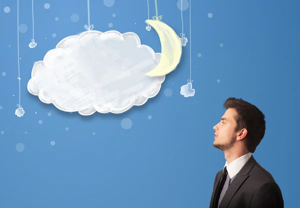 Businessman looking at cartoon night clouds with moon — Stock Photo, Image