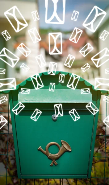 Mailbox with letter icons on glowing green background — Stock Photo, Image