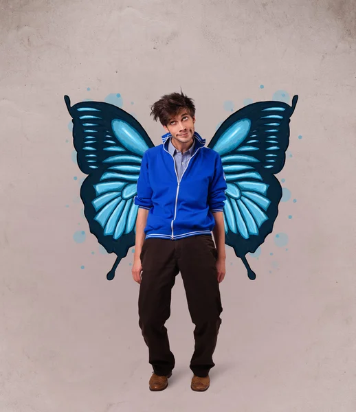 Handsome young man with butterfly blue illustration on the back — Stock Photo, Image