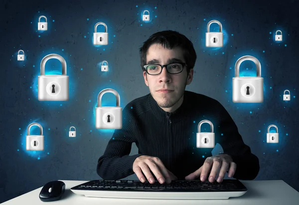 Young hacker with virtual lock symbols and icons — Stock Photo, Image