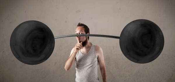 Funny skinny guy lifting weights — Stock Photo, Image