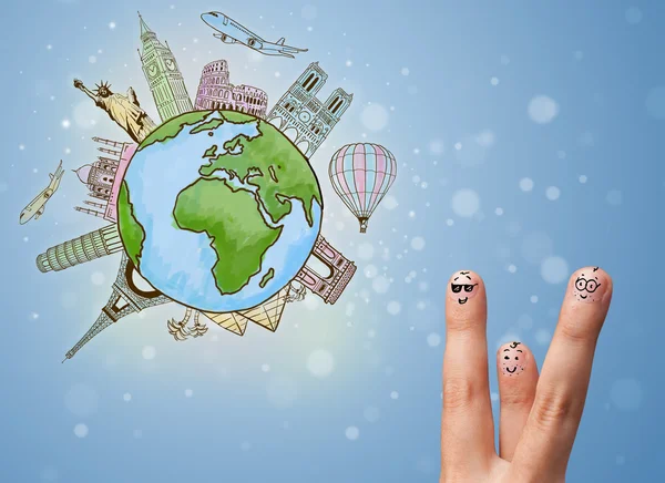 Cheerful finger smileys with famous landmarks of the globe — Stock Photo, Image