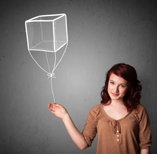 Mulher segurando um balão cubo — Fotografia de Stock