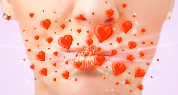 Pretty lady lips with lovely red hearts — Stock Photo, Image