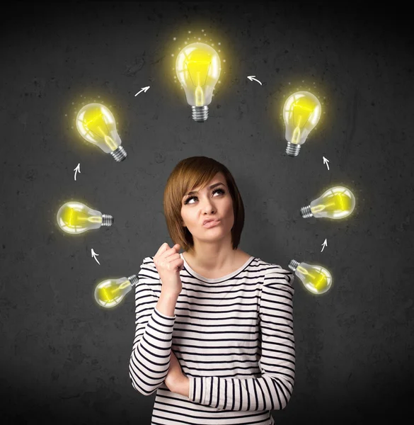 Young woman thinking with lightbulb circulation around her head — Stock Photo, Image