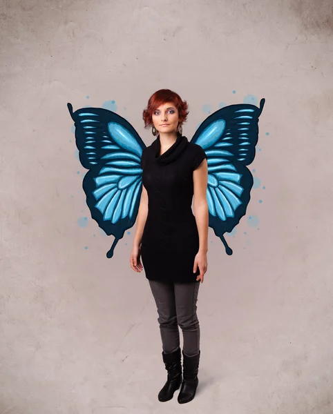 Young girl with butterfly blue illustration on the back — Stock Photo, Image