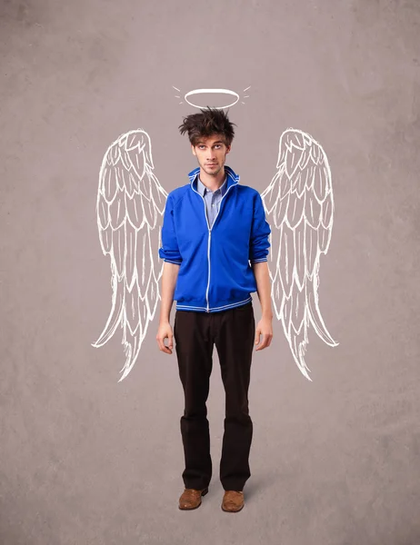 Young man with angel illustrated wings — Stockfoto