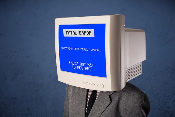 Person with a monitor head and fatal error blue screen on the di — Stock Photo, Image