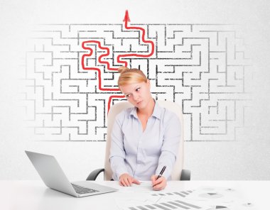 Business woman at desk with labyrinth and arrow clipart