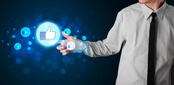 Handsome person pressing thumbs up button on modern social netwo — Stock Photo, Image