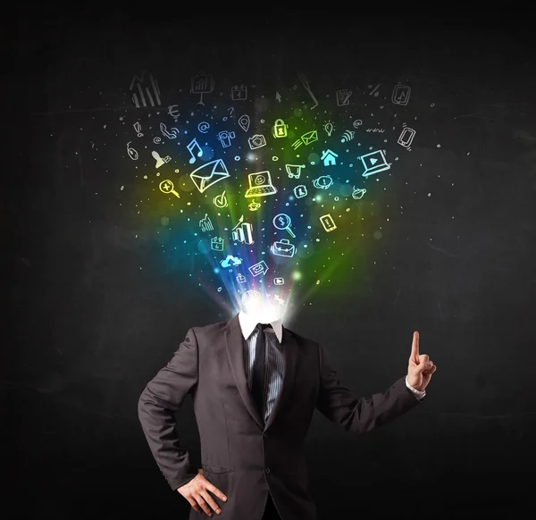 Business man with glowing media icons exploding head — Stock Photo, Image