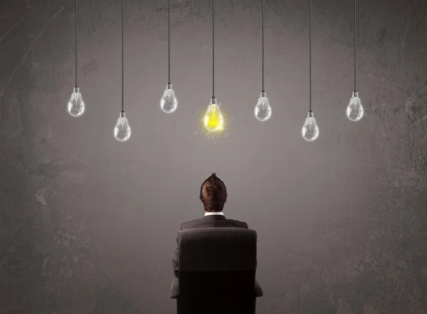 Businness guy in front of idea light bulbs concept — Stock Photo, Image