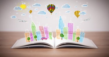 Açık kitap üzerine şehir manzarası çizimi