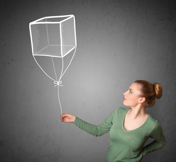 Woman holding a cube balloon — Stock Photo, Image