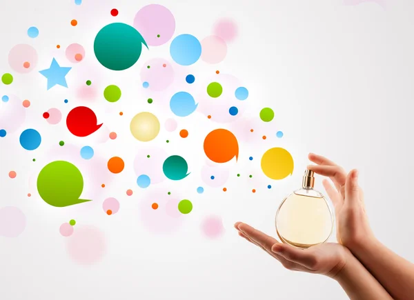 Woman hands spraying colorful bubbles — Stock Photo, Image