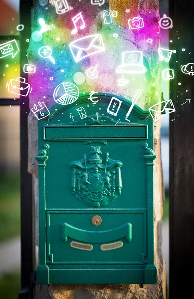 Colorful icons and symbols bursting out of a mailbox — Stock Photo, Image