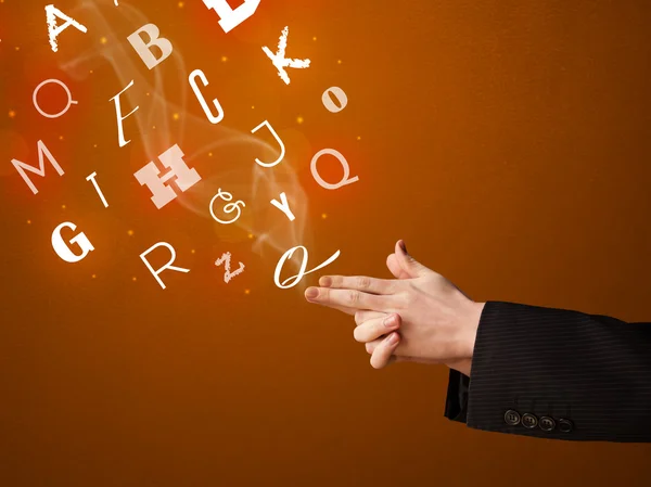 Letters coming out of gun shaped hands — Stock Photo, Image