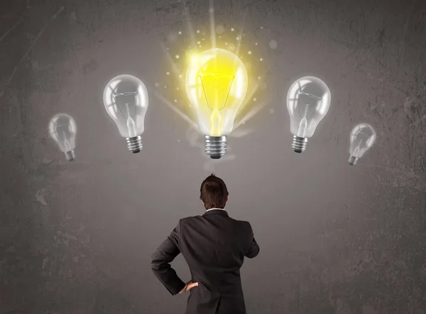 Business person having an idea light bulb concept — Stock Photo, Image