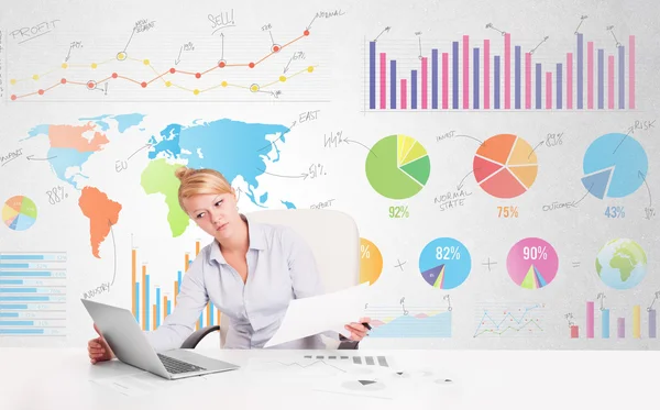 Business woman with colorful charts — Stock Photo, Image