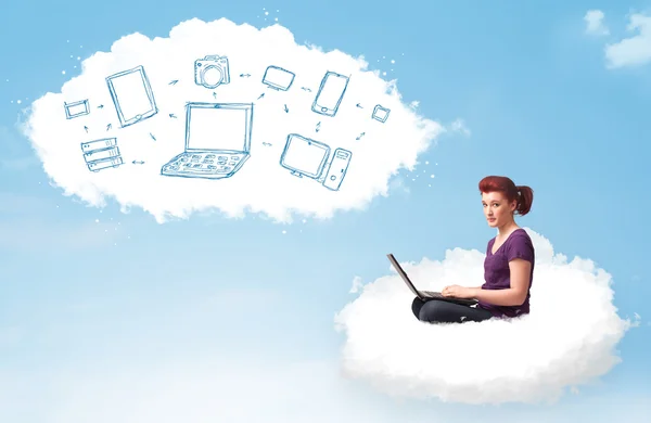 Young woman sitting in cloud with laptop — Stock Photo, Image