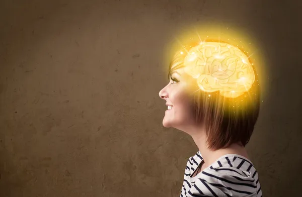 Young girl thinking with glowing brain illustration — Stock Photo, Image