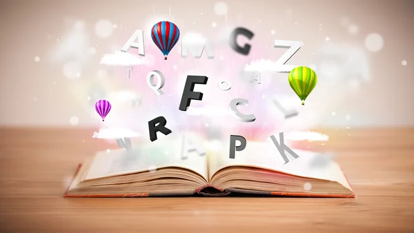 Open book with flying 3d letters on concrete background — Stock Photo, Image