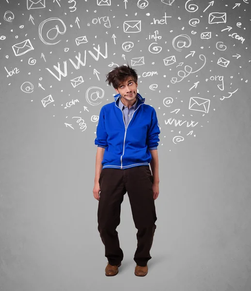 Casual young man with abstract white media icon doodles — Stock Photo, Image