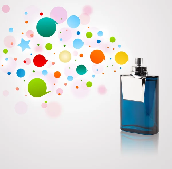 Perfume bottle spraying colored bubbles — Stock Photo, Image