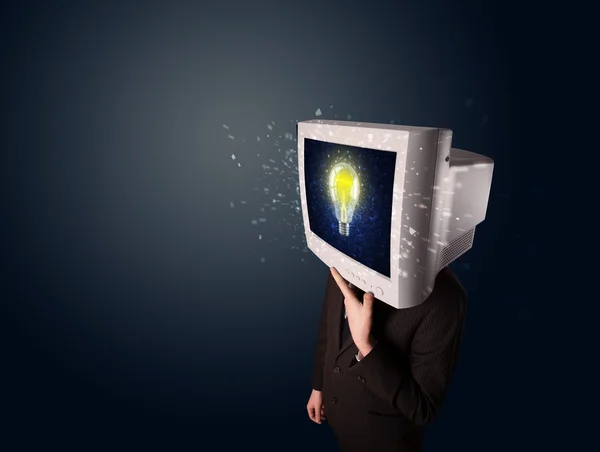 Affärsman med en pc monitor huvud och idé glödlampa i d — Stockfoto