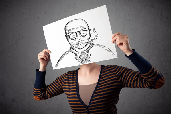 Woman holding a cardboard with a smoking man on it in front of h — Stock Photo, Image