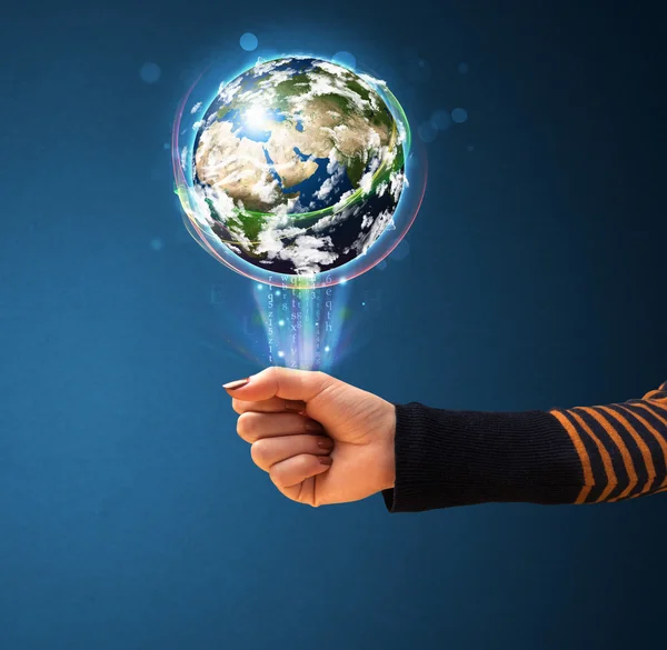 Woman holding a glowing earth globe — Stock Photo, Image