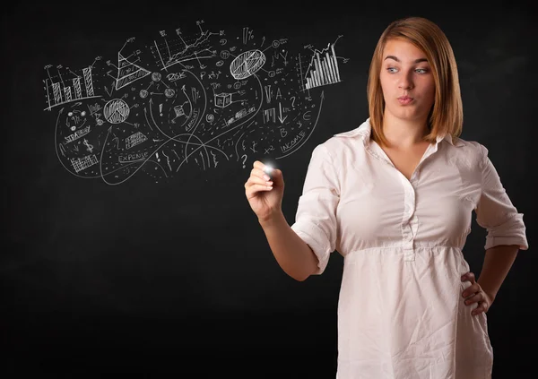 Menina bonita esboçando gráficos e diagramas na parede — Fotografia de Stock