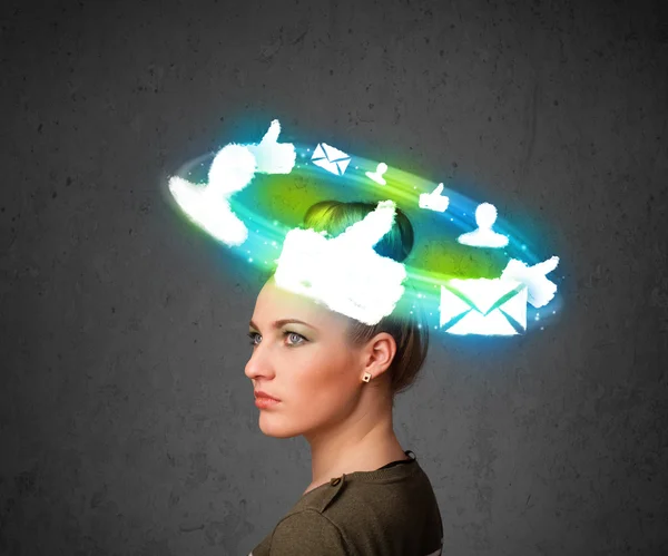 Young teenager with cloud social icons around her head — Stock Photo, Image