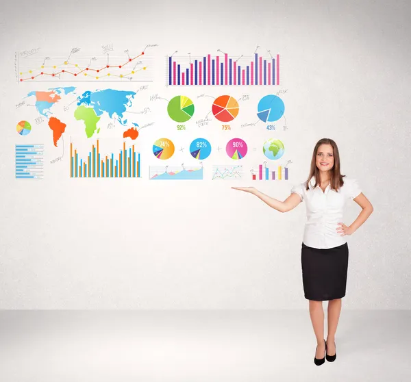 Business woman with colorful graphs and charts — Stock Photo, Image