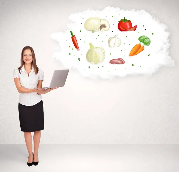 Young girl presenting nutritional cloud with vegetables — Stock Photo, Image