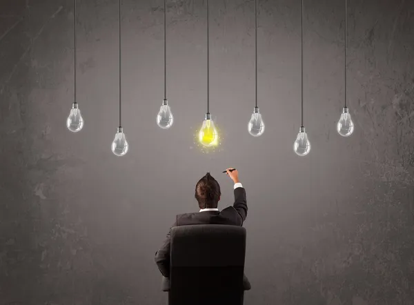 Businness guy in front of idea light bulbs concept — Stock Photo, Image